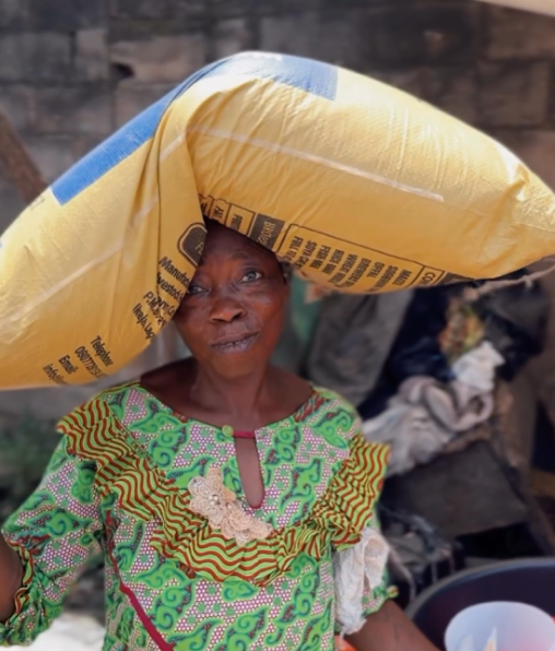 woman with a bag of rice